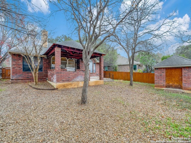 view of front of home featuring an outbuilding