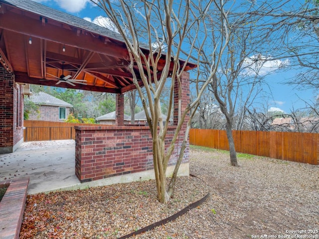 view of patio / terrace with a gazebo and ceiling fan