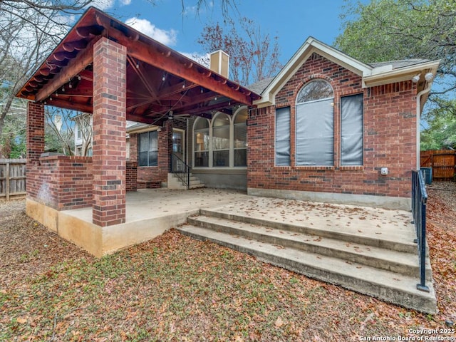 rear view of house featuring a patio