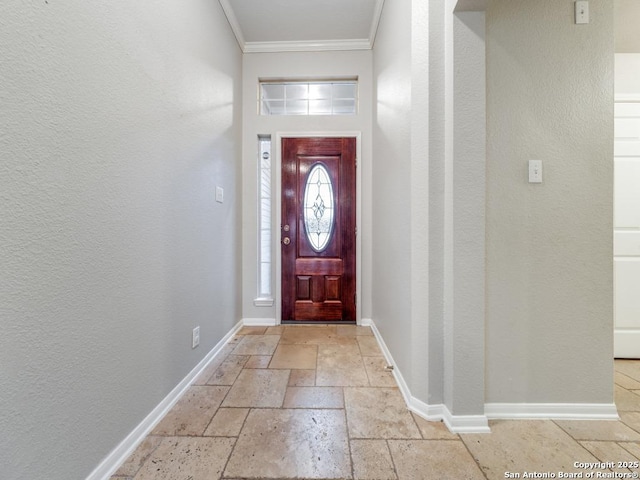 entrance foyer featuring crown molding