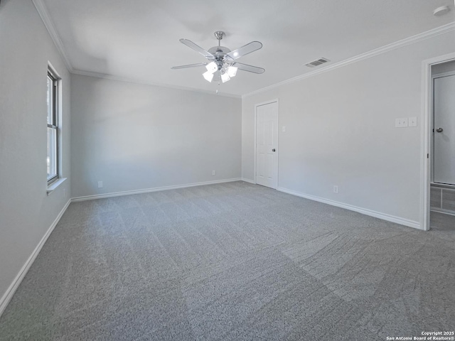 unfurnished room with ornamental molding, ceiling fan, and carpet flooring