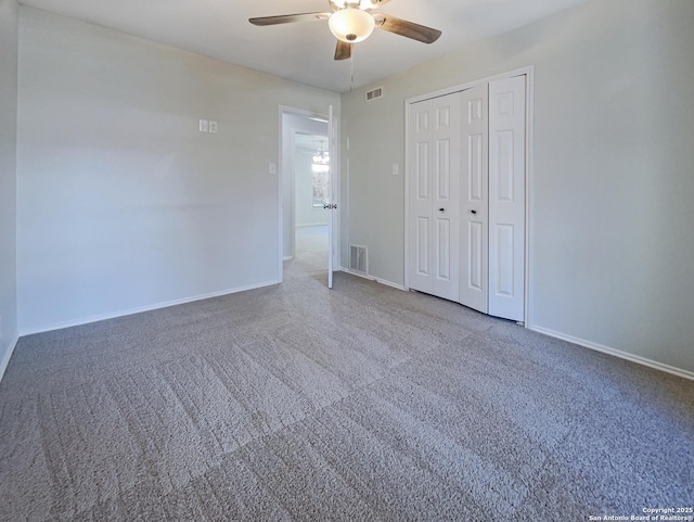 unfurnished bedroom featuring a closet, ceiling fan, and carpet