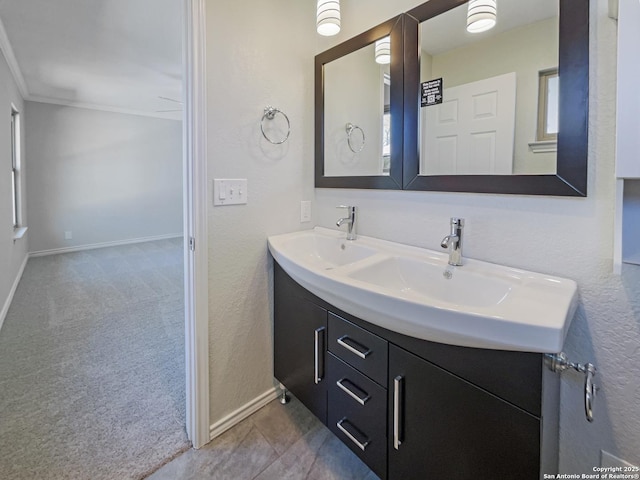 bathroom featuring ornamental molding and vanity