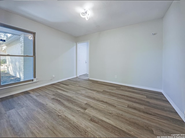 unfurnished room featuring hardwood / wood-style floors