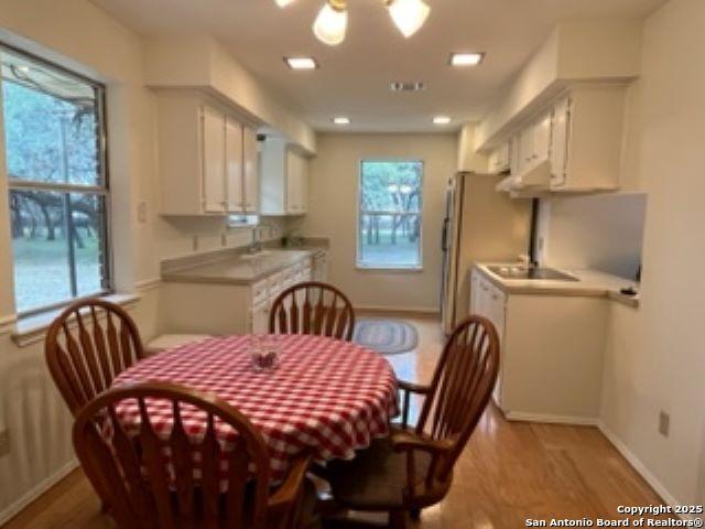 dining room featuring a chandelier and light hardwood / wood-style floors