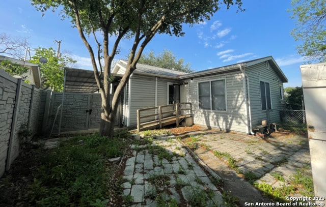 back of property featuring a patio area