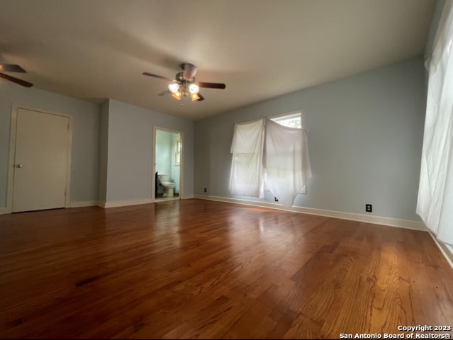 empty room featuring wood-type flooring and ceiling fan