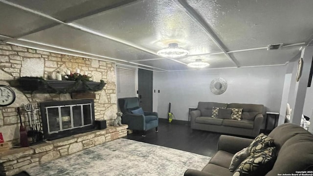 living room featuring dark hardwood / wood-style floors and a fireplace