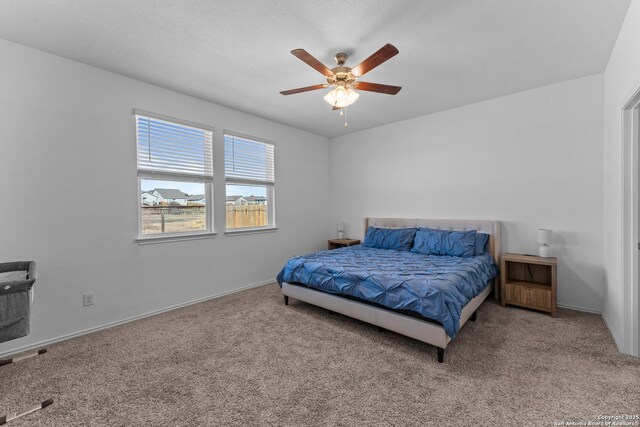 bedroom featuring ceiling fan and carpet flooring