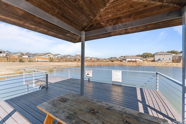 dock area with a deck with water view