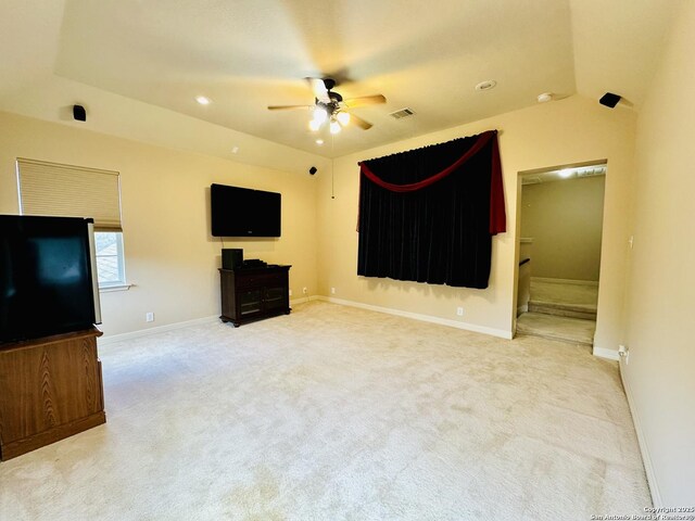 unfurnished living room featuring carpet floors and ceiling fan