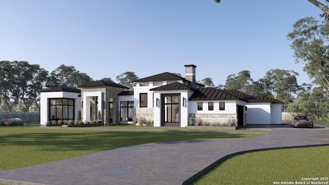 view of front of property with a garage and a front yard