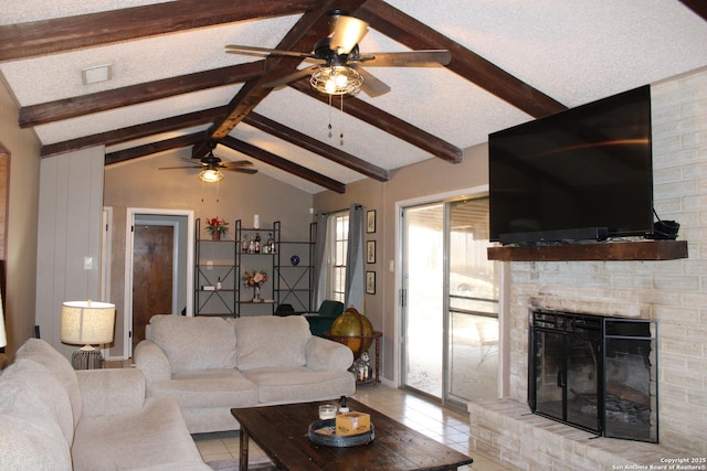 living room with light tile patterned flooring, a fireplace, lofted ceiling with beams, and a textured ceiling