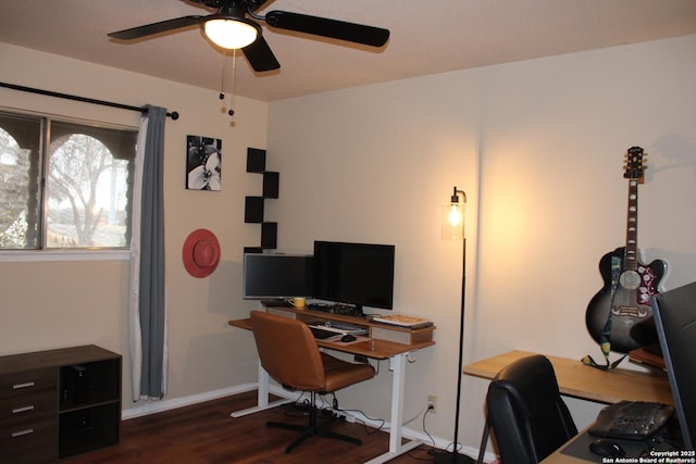 home office featuring dark wood-type flooring and ceiling fan