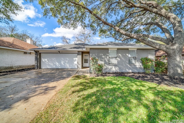 ranch-style house with a garage and a front yard