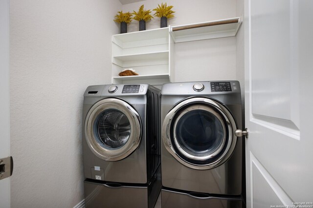 washroom with independent washer and dryer