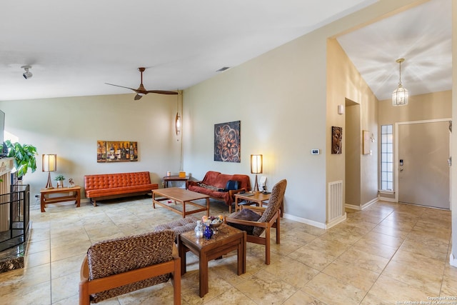 tiled living room with lofted ceiling and ceiling fan