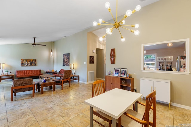 dining room featuring ceiling fan with notable chandelier and high vaulted ceiling