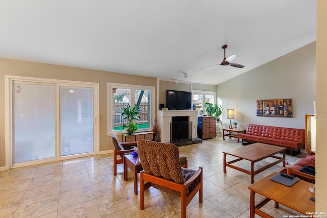 living room featuring light tile patterned flooring, ceiling fan, and lofted ceiling