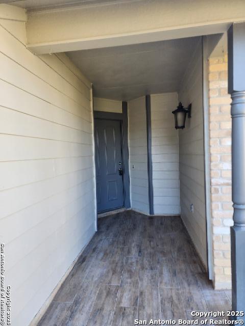 property entrance with brick siding