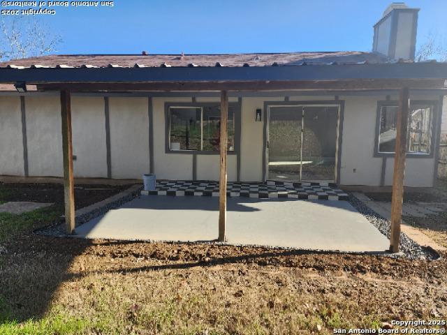 rear view of property featuring a patio