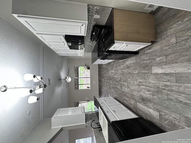 kitchen featuring white cabinets