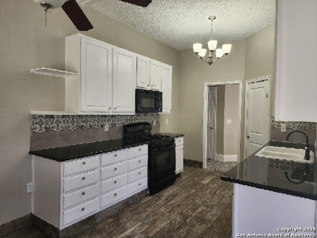 kitchen with open shelves, a sink, white cabinets, black appliances, and dark countertops