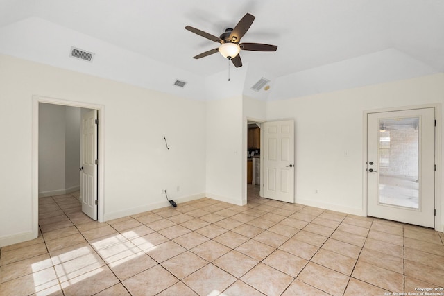 tiled empty room with lofted ceiling and ceiling fan