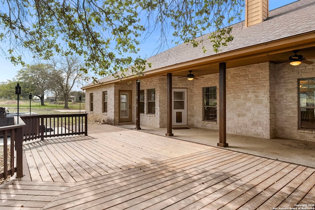 wooden terrace featuring ceiling fan