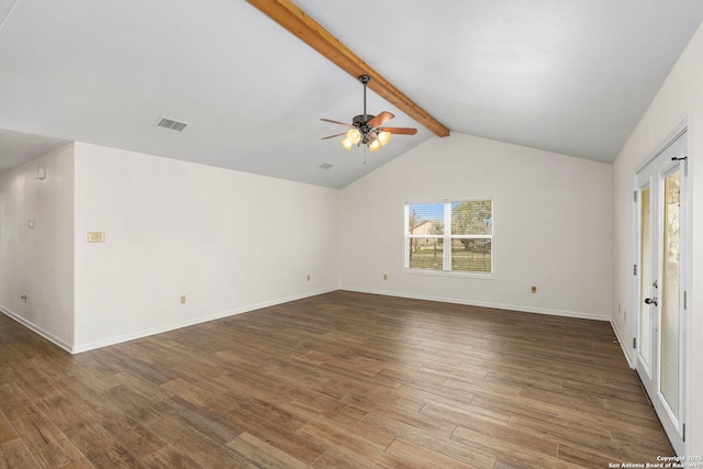 spare room with hardwood / wood-style flooring, ceiling fan, and lofted ceiling with beams