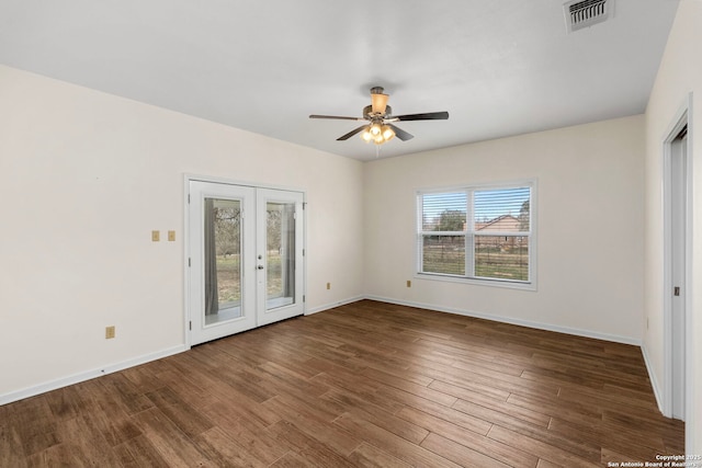 unfurnished room with hardwood / wood-style floors, ceiling fan, and french doors