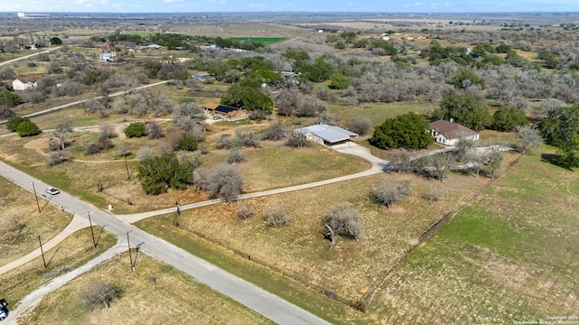 birds eye view of property featuring a rural view