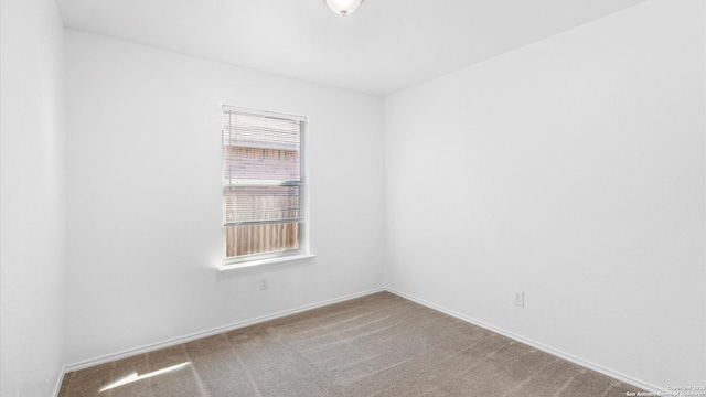 empty room featuring light carpet