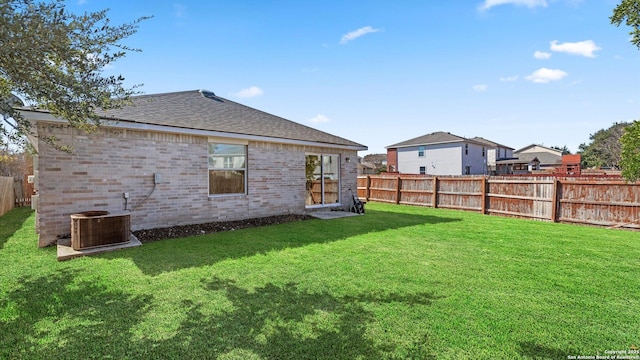 view of yard featuring central AC