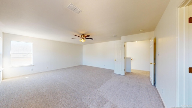 carpeted empty room with ceiling fan