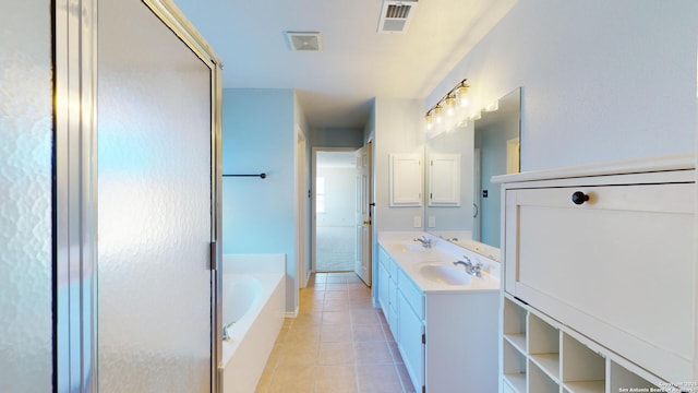 bathroom with tile patterned floors, independent shower and bath, and vanity