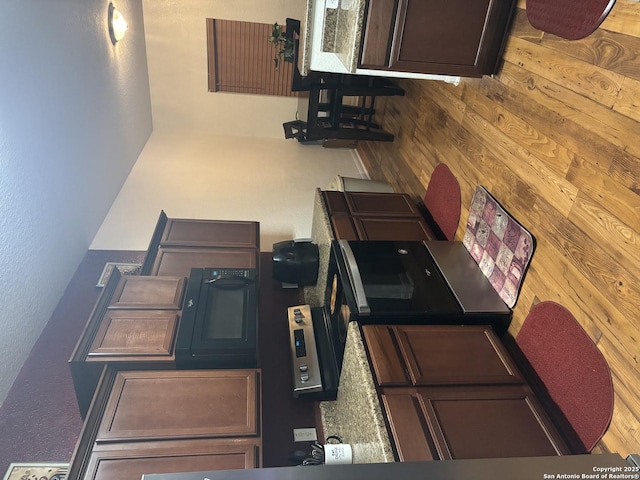 kitchen with dark brown cabinetry