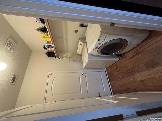 laundry room featuring wood walls