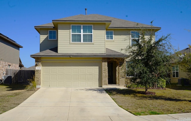 view of front of home featuring cooling unit, a garage, and a front lawn