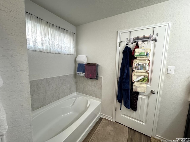 bathroom featuring a tub