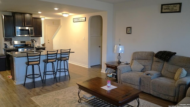 living room with dark wood-type flooring