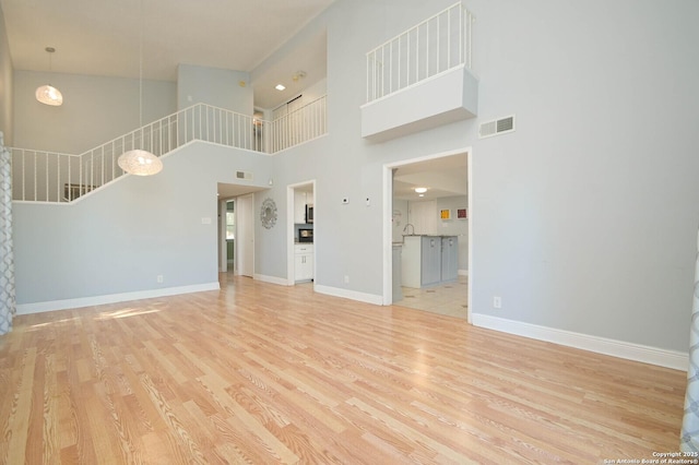 unfurnished living room featuring light hardwood / wood-style flooring