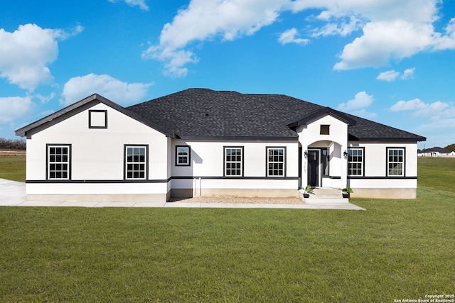 view of front of property with a front lawn