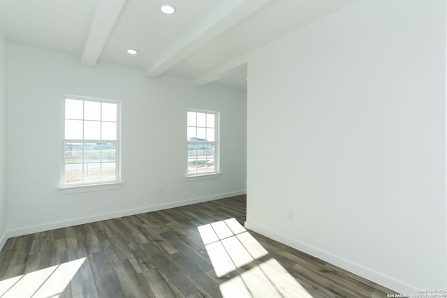 unfurnished room featuring dark wood-type flooring and beamed ceiling