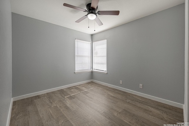 unfurnished room featuring hardwood / wood-style floors and ceiling fan