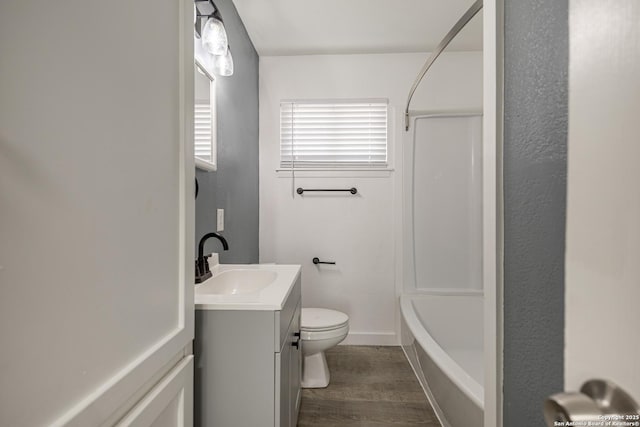 full bathroom with shower / bath combination, vanity, wood-type flooring, and toilet