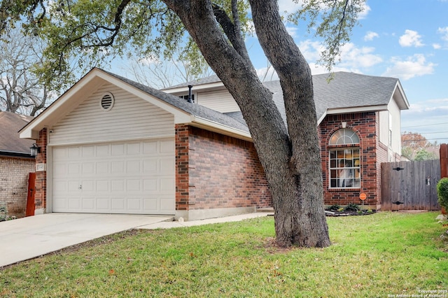 view of front facade with a garage and a front lawn