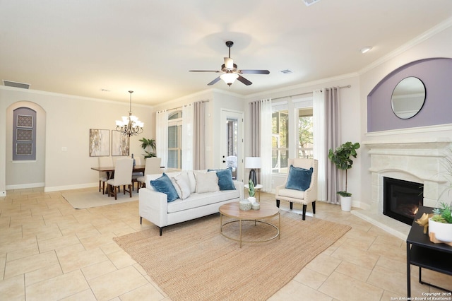 living room featuring crown molding, ceiling fan with notable chandelier, and light tile patterned floors