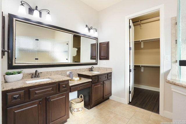 bathroom with vanity and tile patterned floors