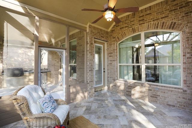 view of patio featuring ceiling fan